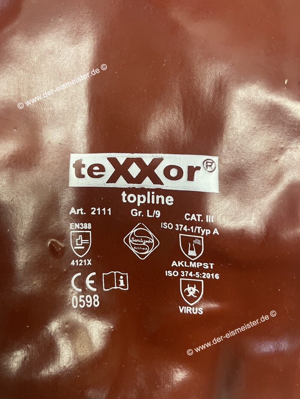 Aufdruck am Handschuh: teXXor topline Art. 2111, ISO 374-1 Typ A, EN 388 4121X, ISO 374-5 VIRUS